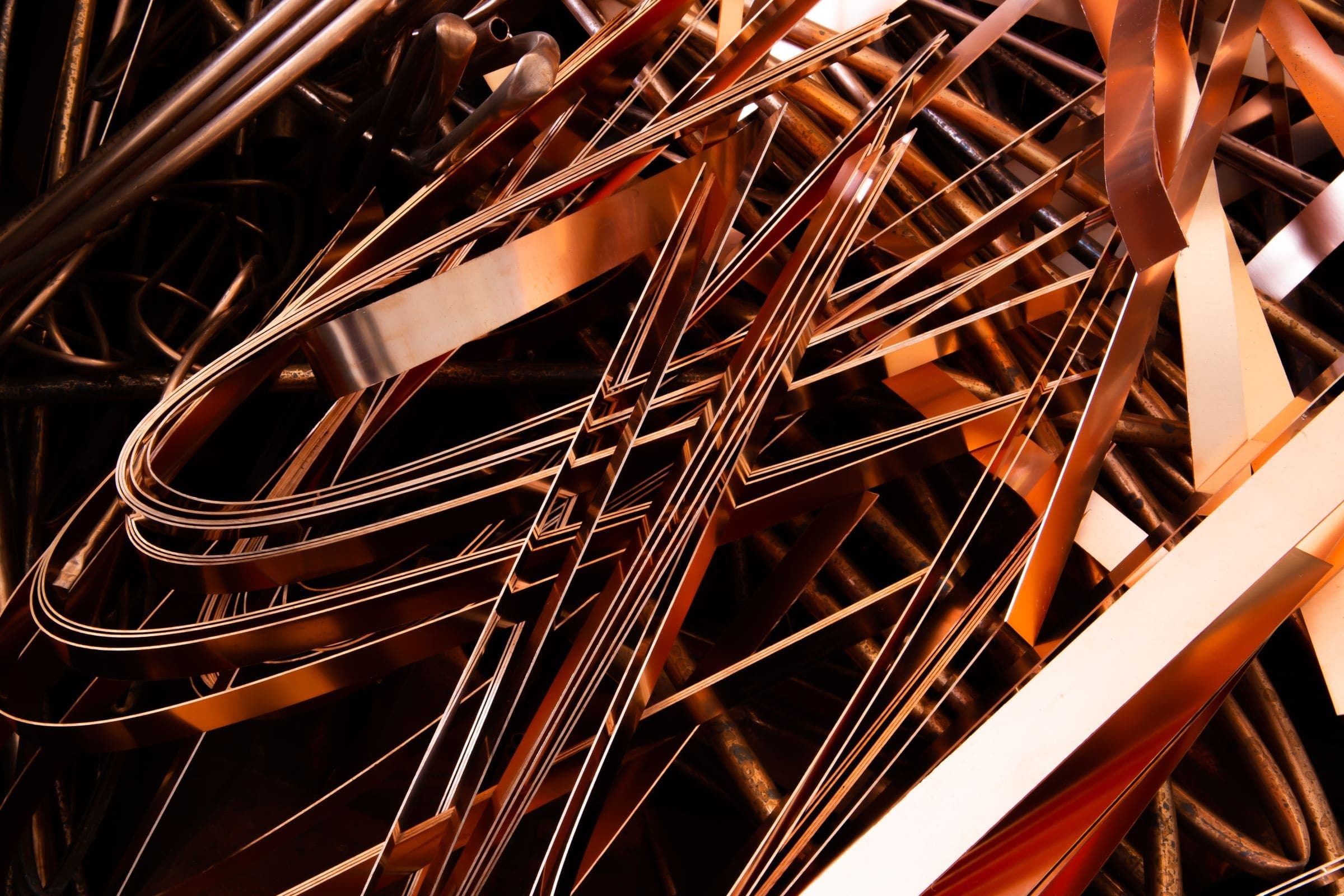 A tangle of shiny copper strips and wire offcuts