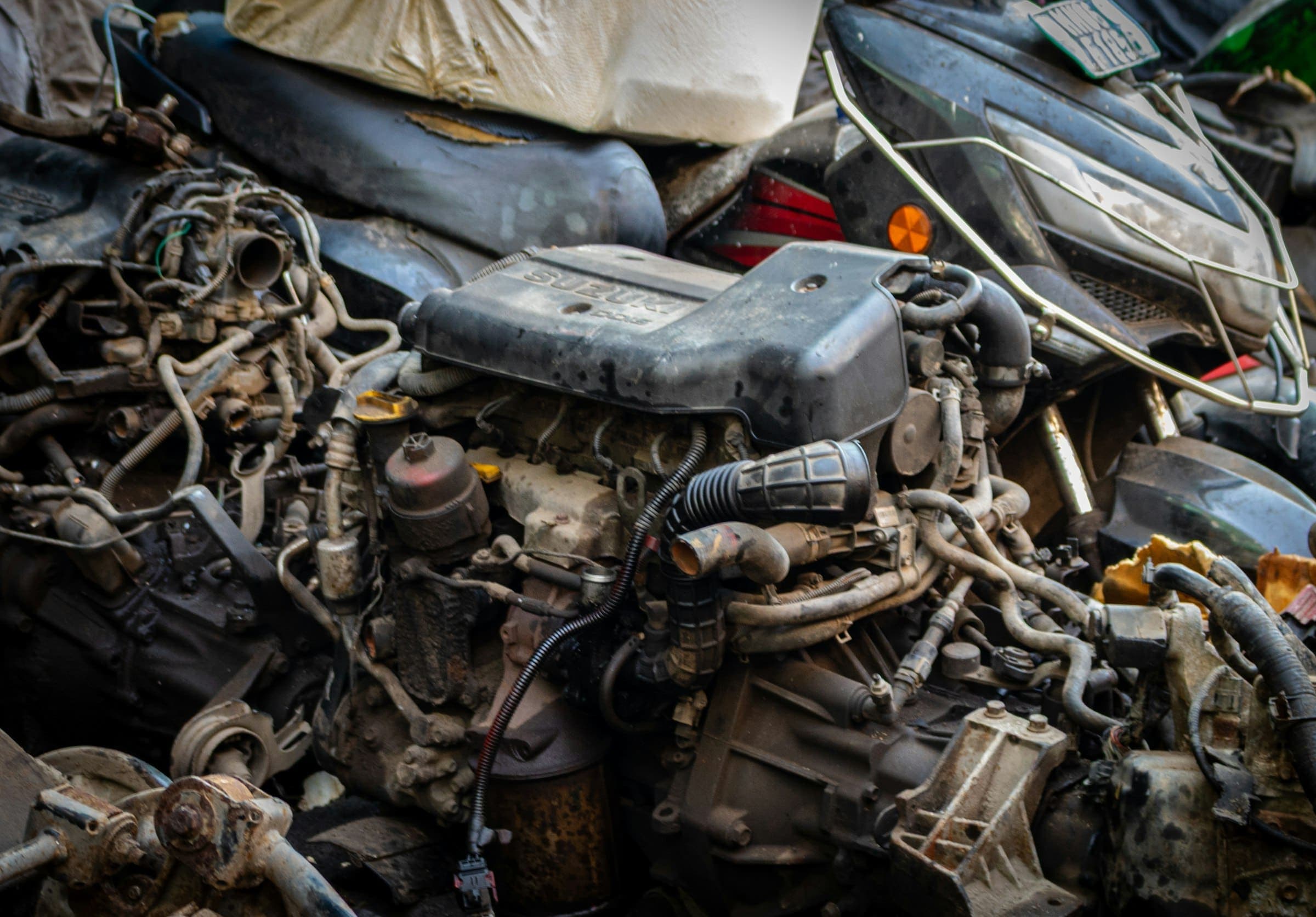 Old car engines and parts A pile of old car engines and parts