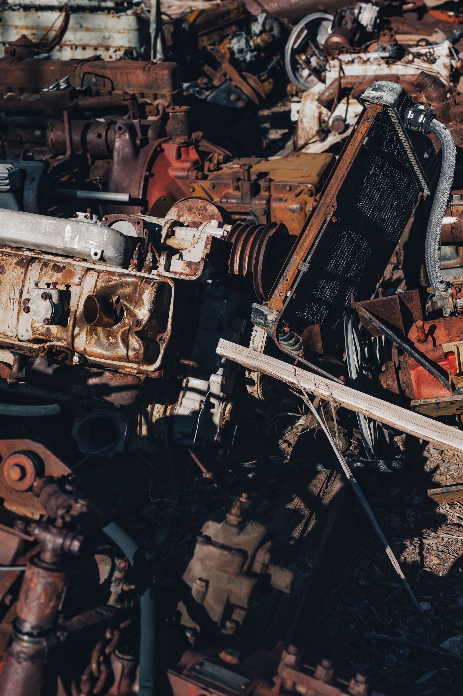 Heap of rusty car parts A tangled heap of rusty engine parts and a radiator in a wrecking yard